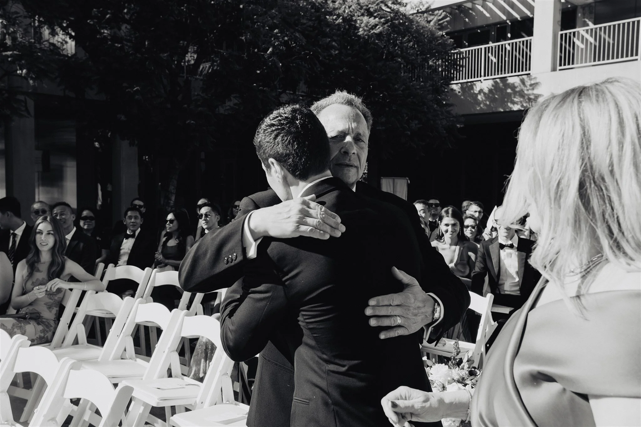 groom walking down the aisle for his wedding ceremony at skirball cultural center