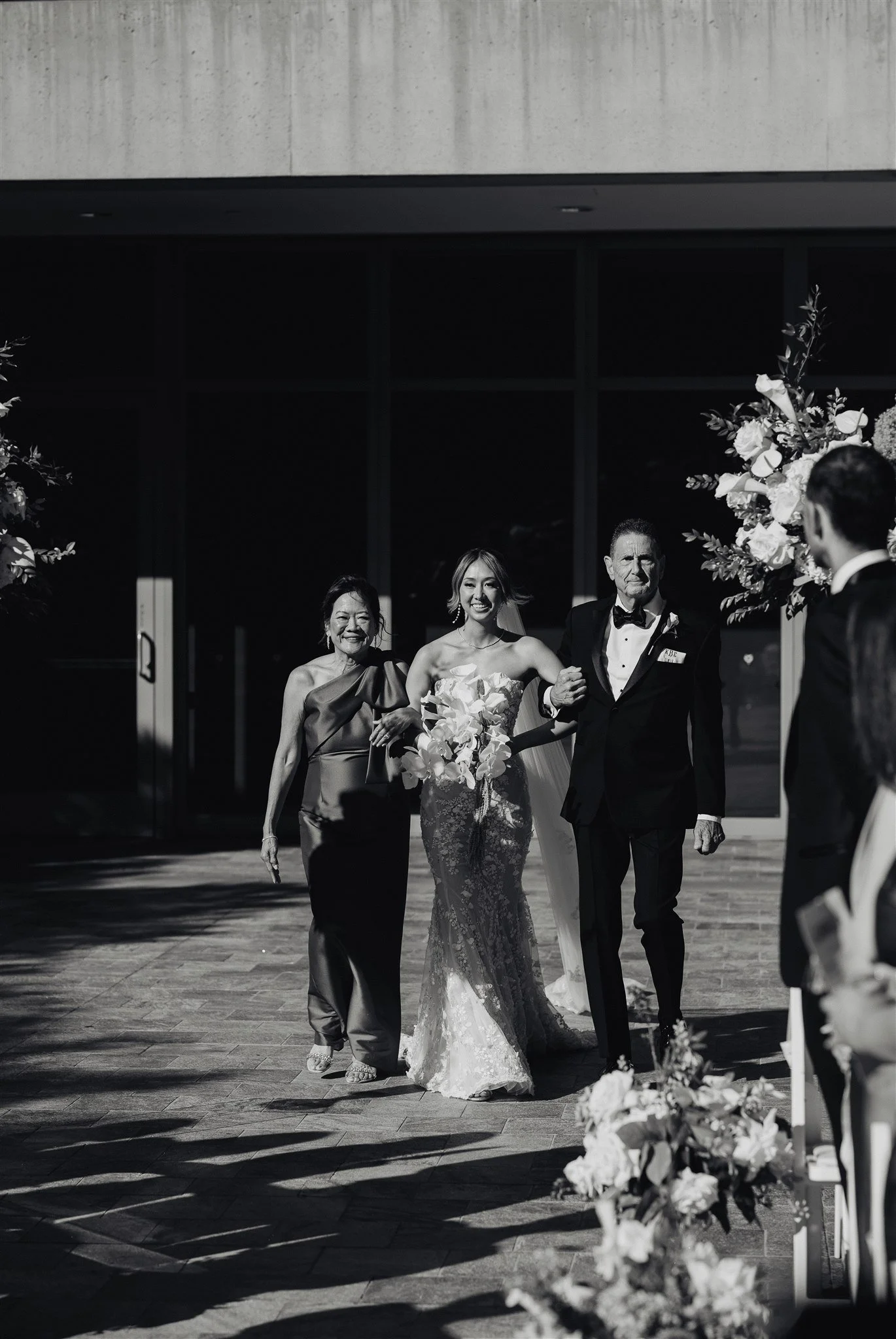 bride walking down the aisle for her wedding ceremony at skirball cultural center