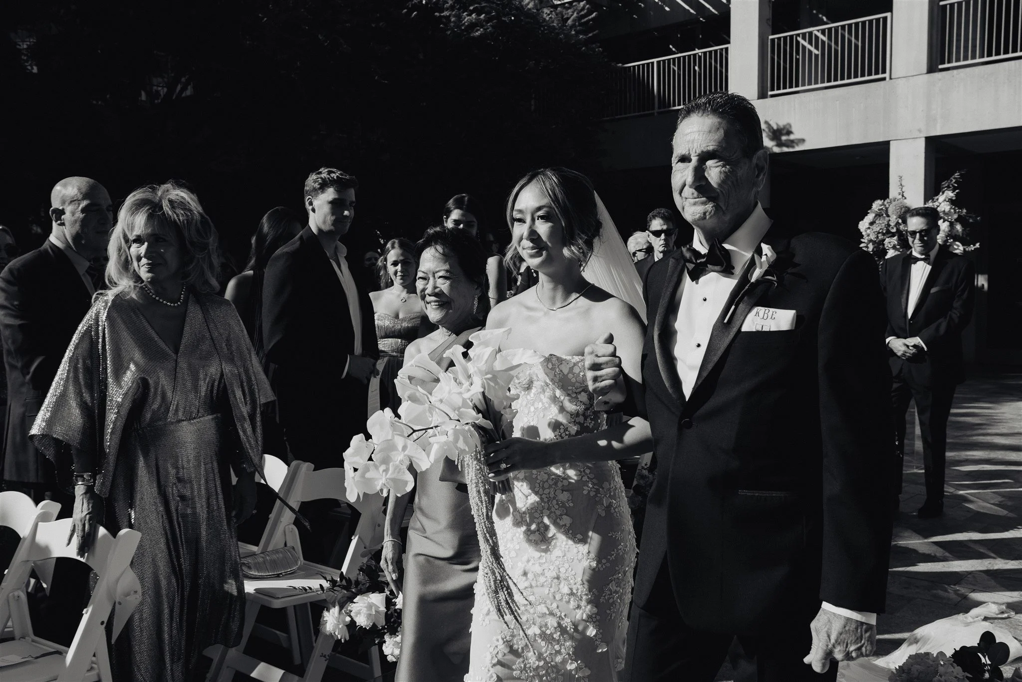 bride walking down the aisle for her wedding ceremony at skirball cultural center