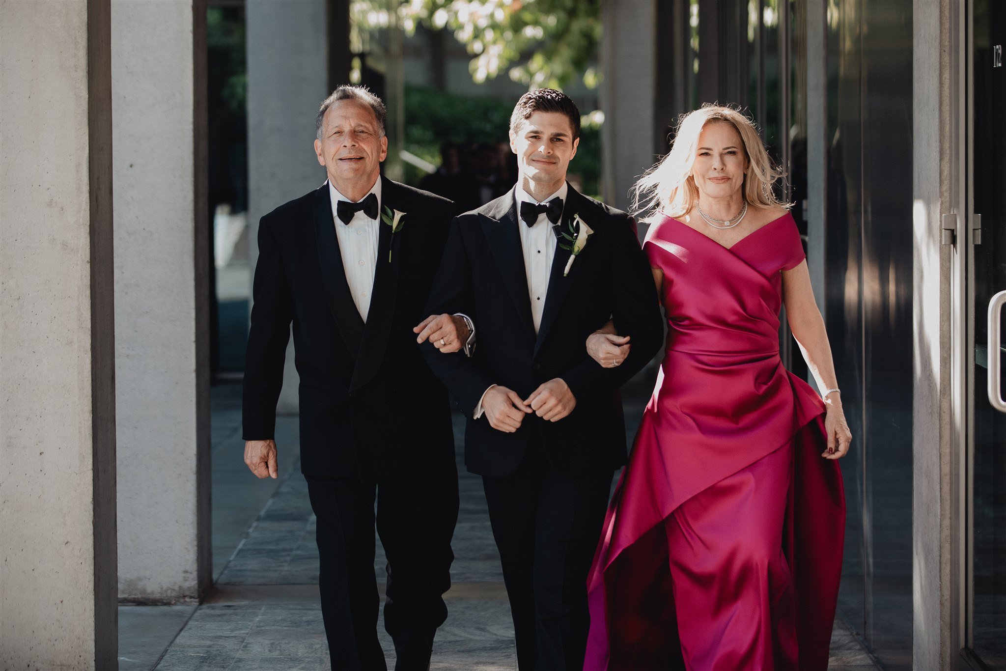 groom walking down the aisle for his wedding ceremony at skirball cultural center
