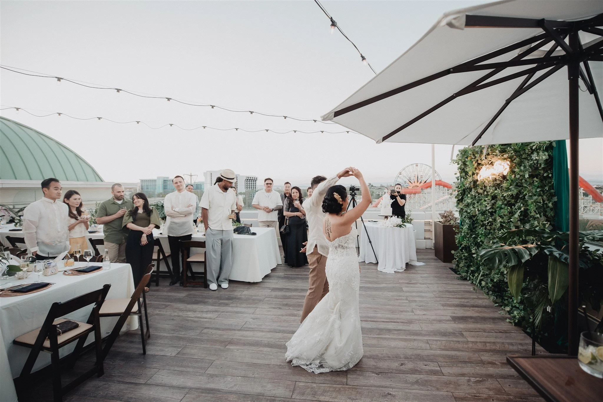 bride and groom first dance at their wedding reception at california adventure disney park