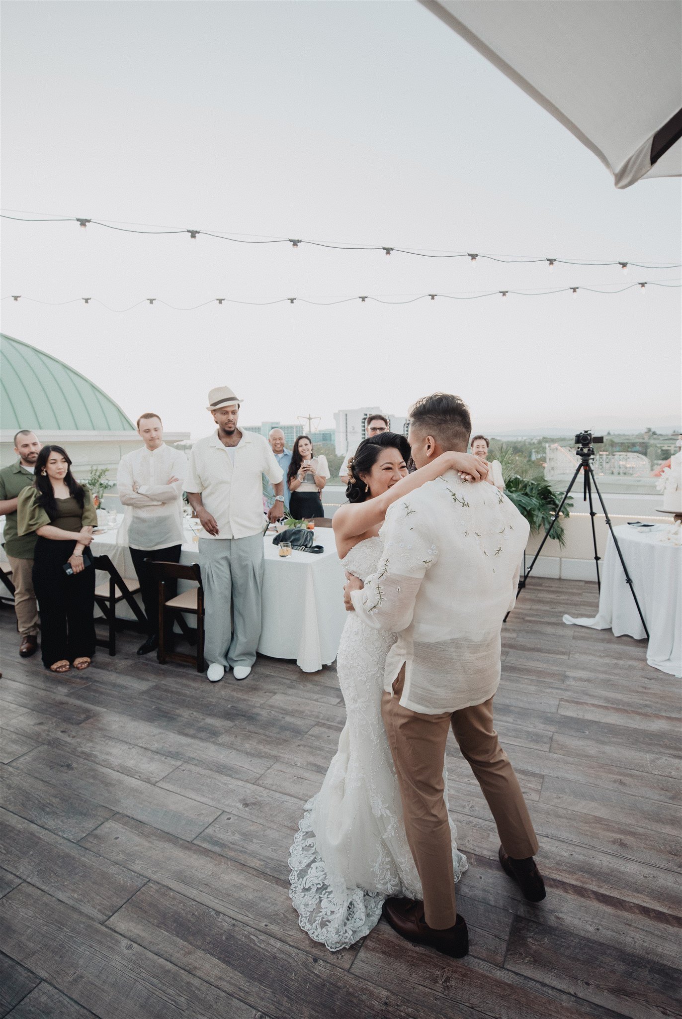 bride and groom first dance at their wedding reception at california adventure disney park