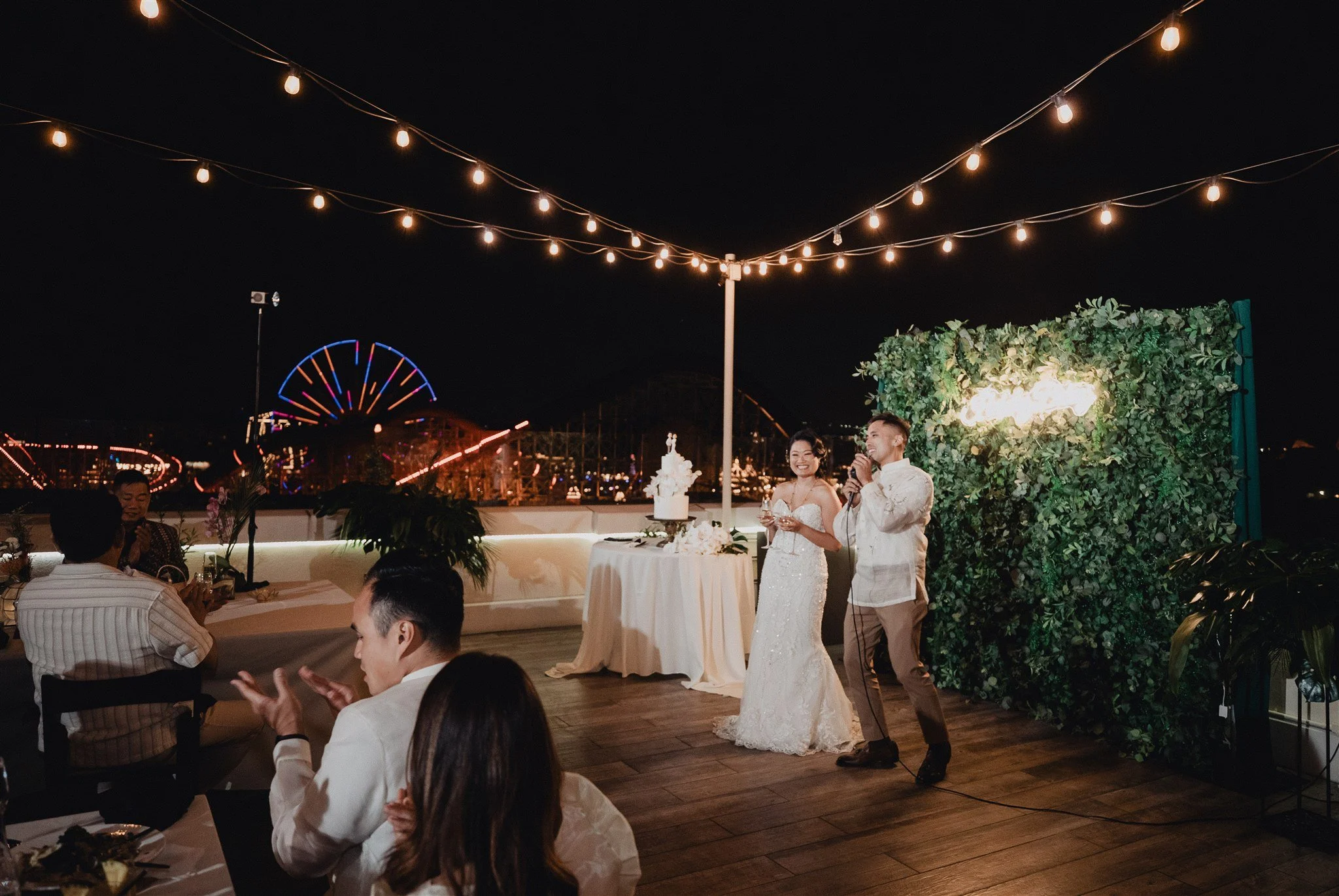 bride and groom at their wedding reception at california adventure disney park
