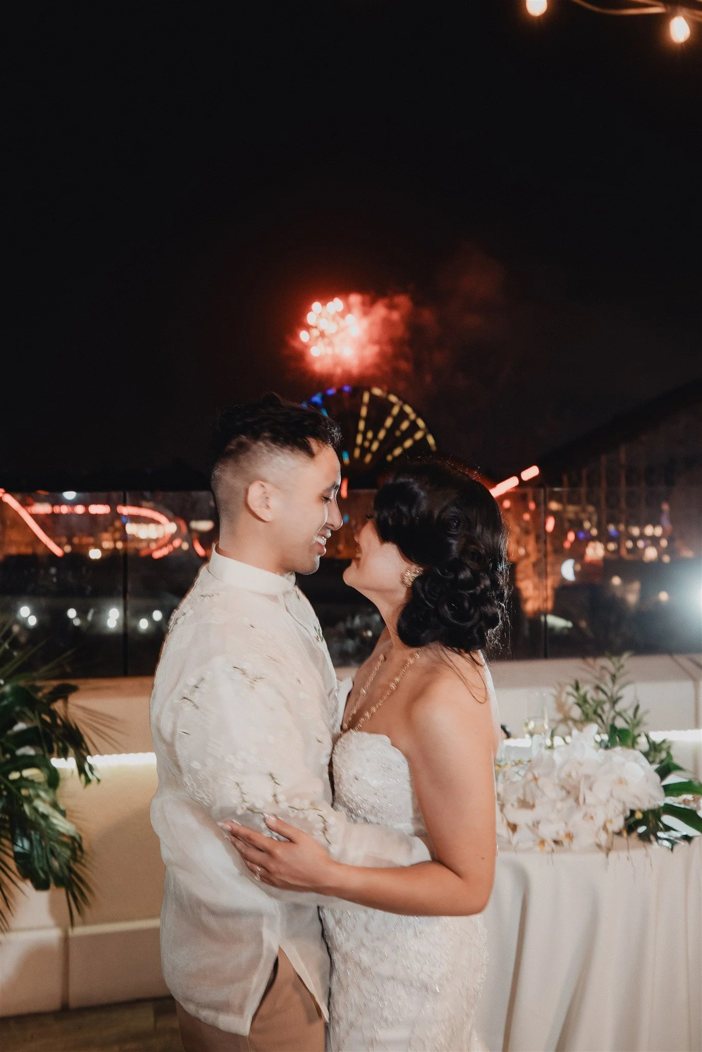 bride and groom at their wedding reception at california adventure disney park