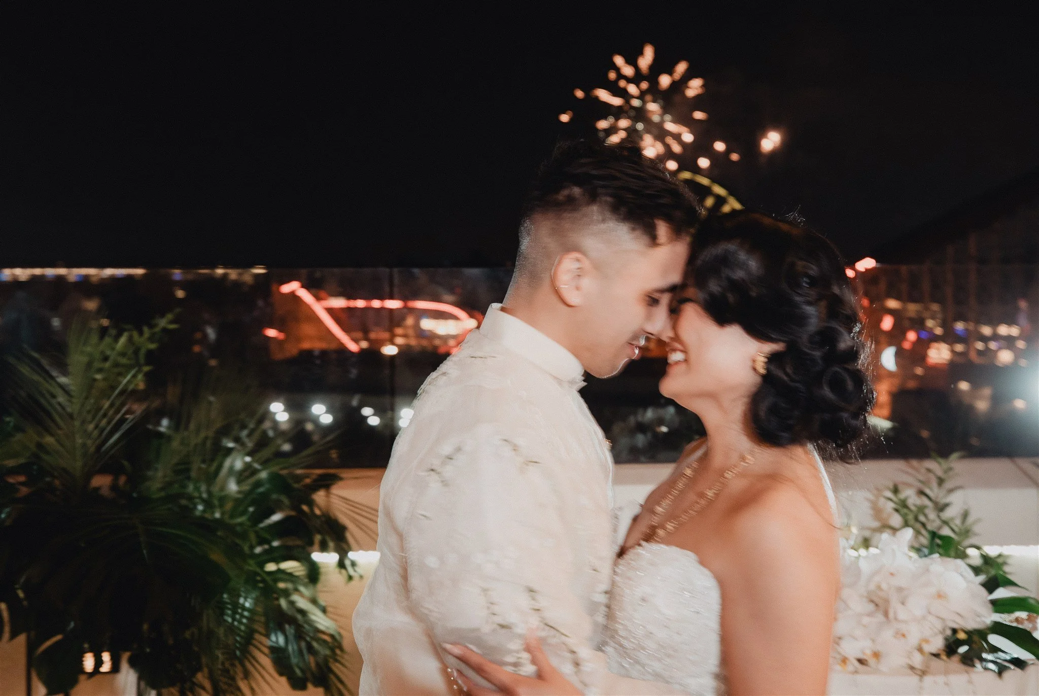 bride and groom at their wedding reception at california adventure disney park