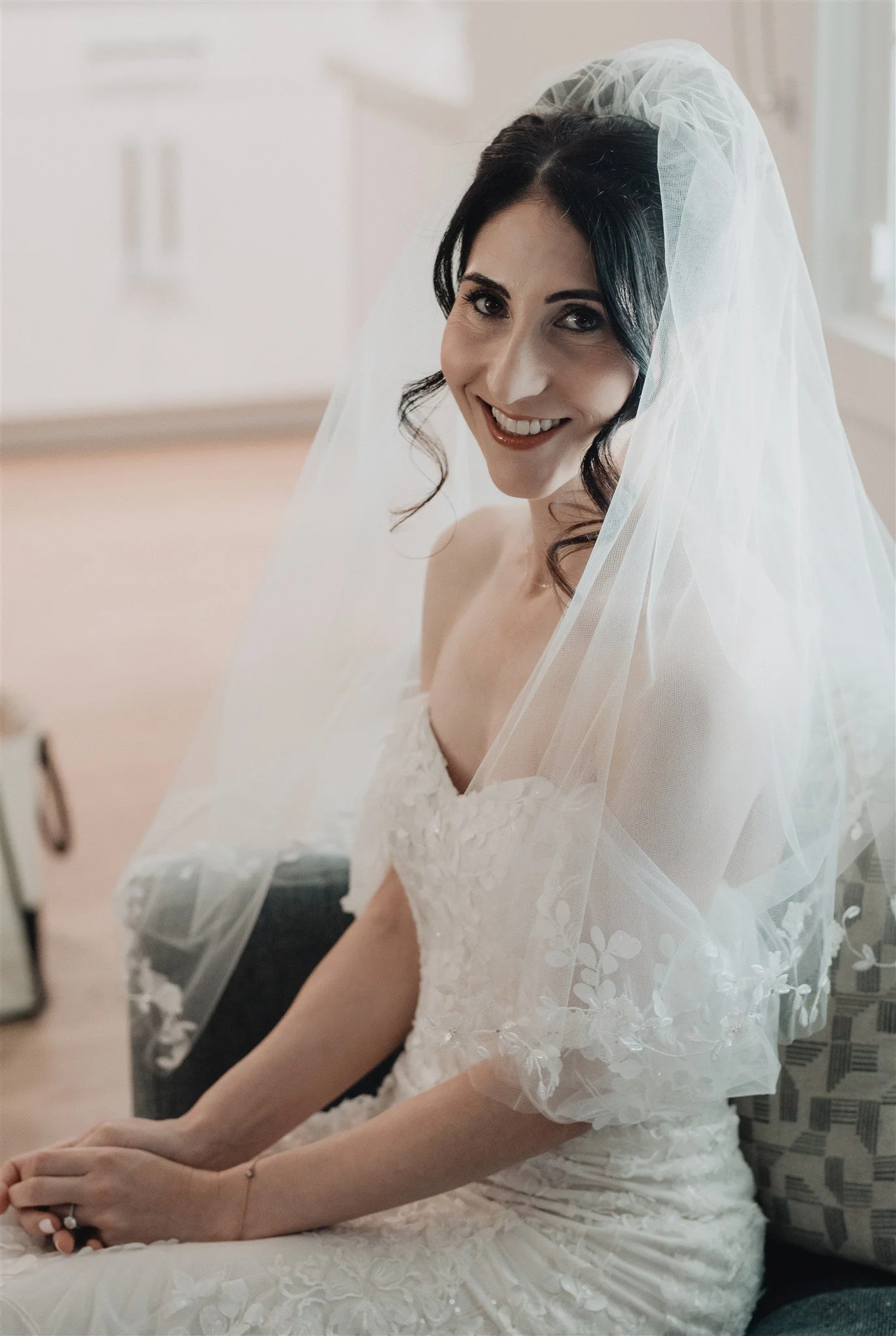 Detail of the bride’s veil and beaded gown