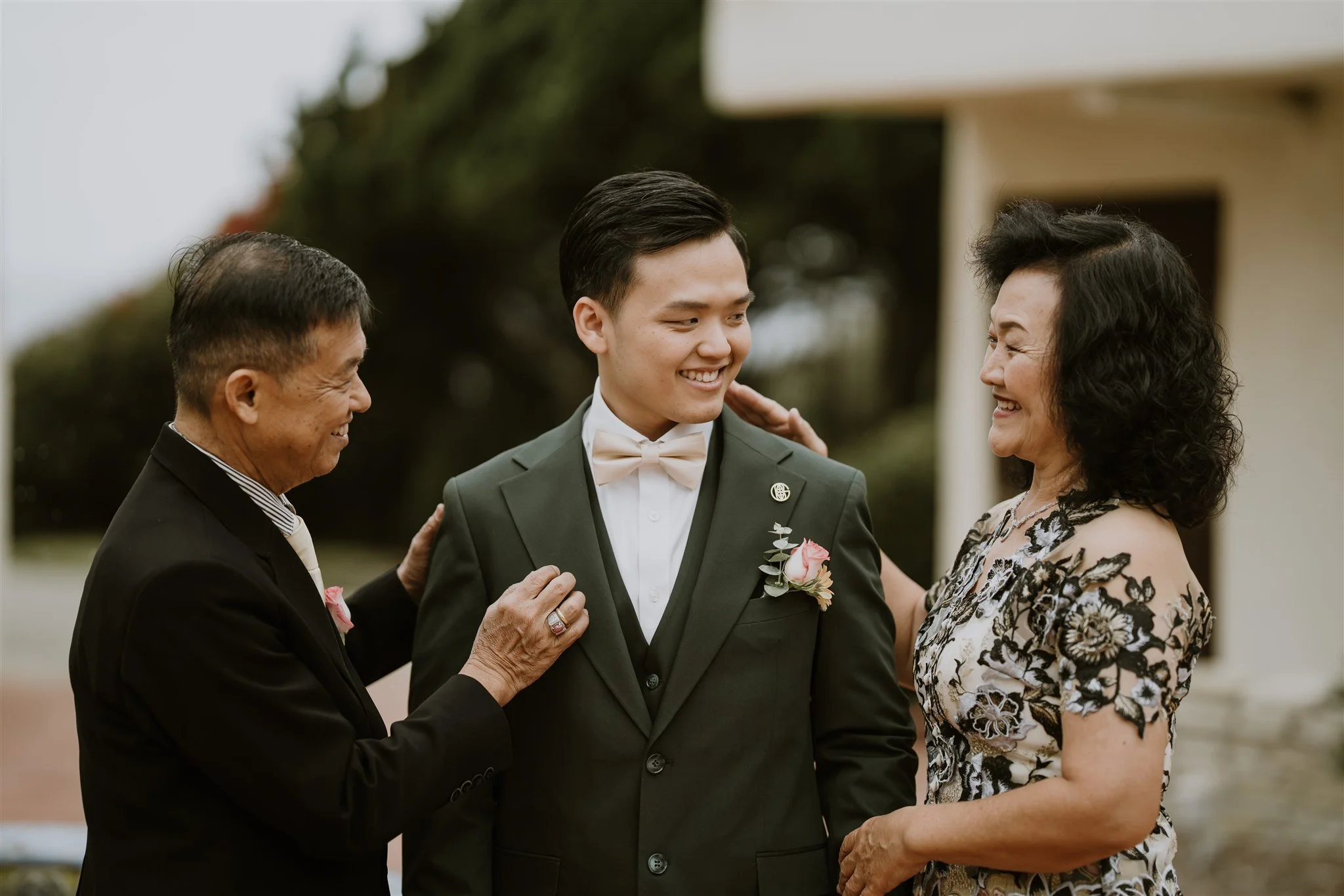 groom getting ready on his wedding day at the neighborhood church