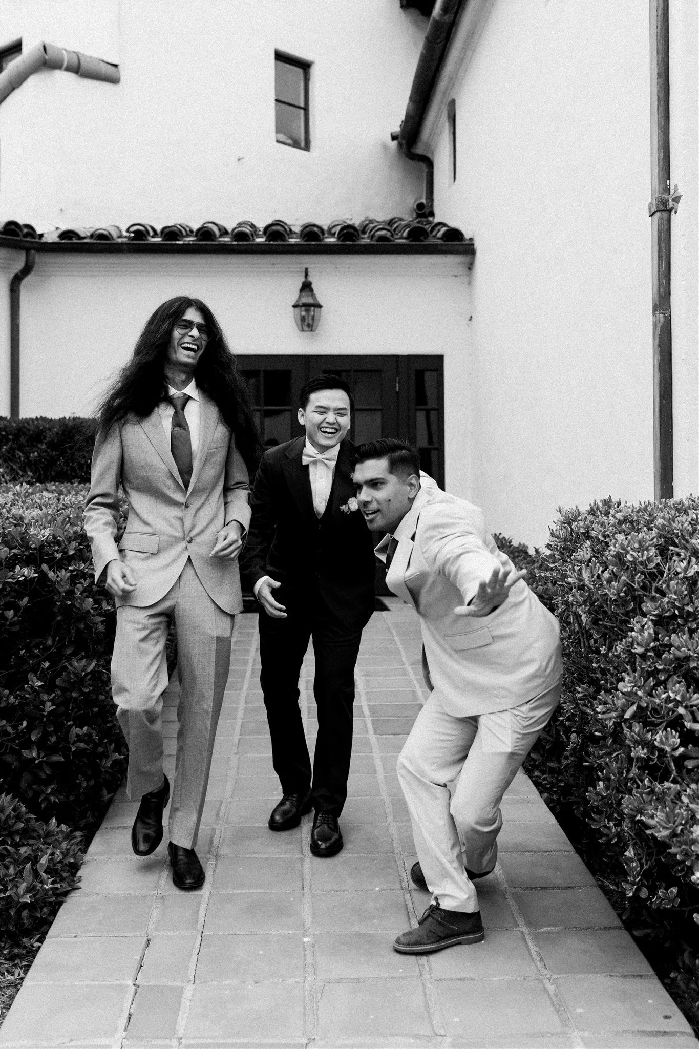 groom getting ready on his wedding day at the neighborhood church