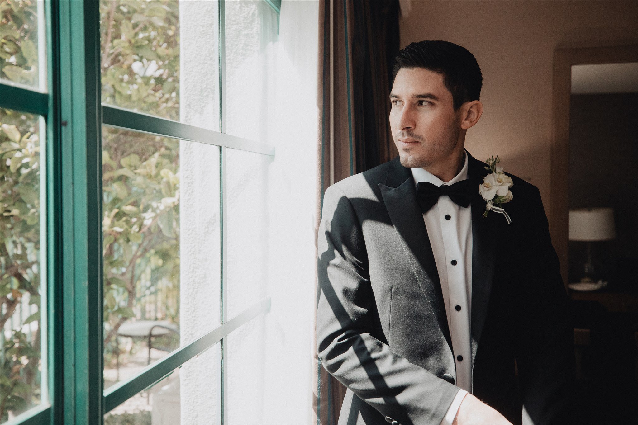 groom getting ready for his wedding day at DoubleTree in San Pedro