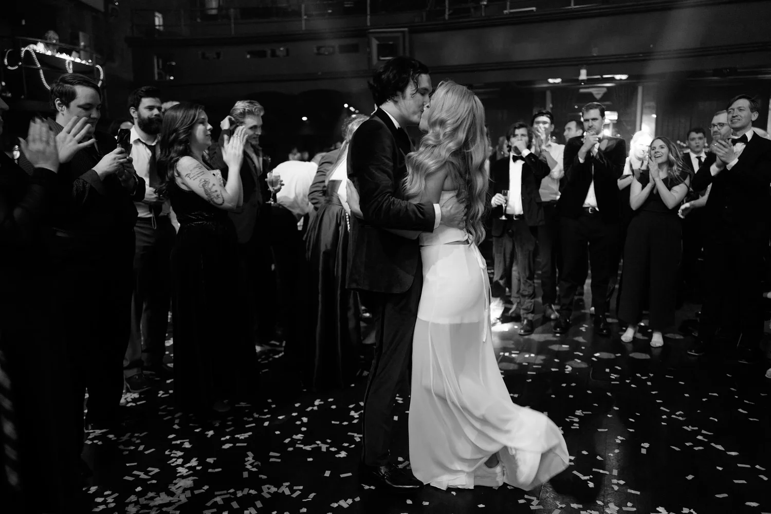 Bride and groom walking back down the aisle through cheering guests at a Los Angeles Jewish wedding