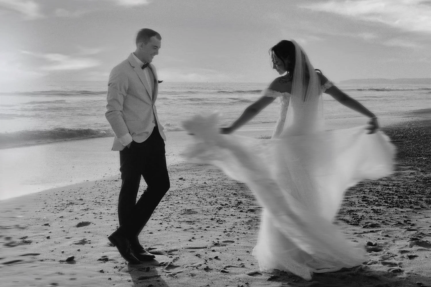 wedding-day-bride-spinning-dress-on-the-beach.jpeg