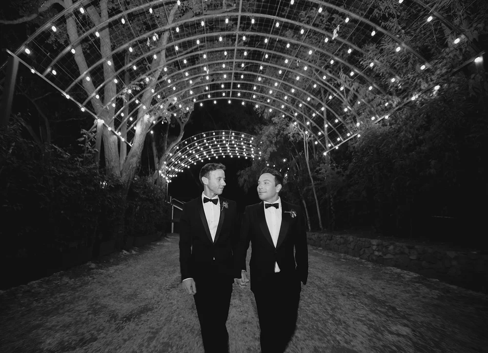 Grahm and Postlethwaite under the string lights at Calamigos Ranch, Malibu