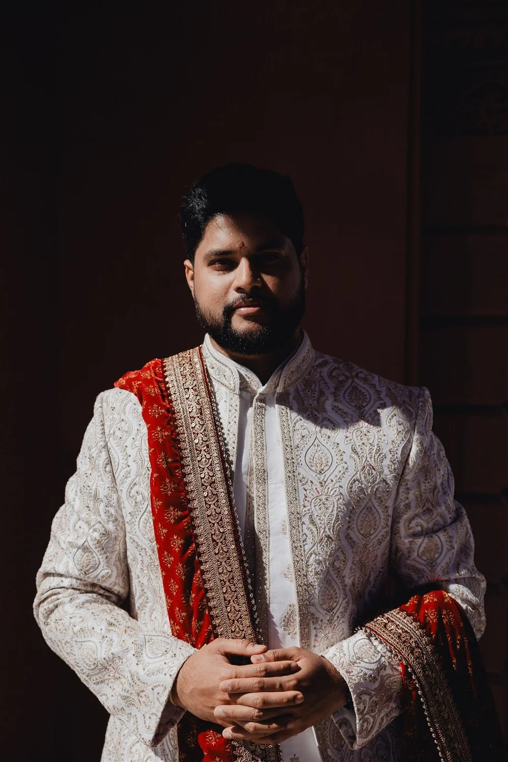 Groom in a white embroidered sherwani