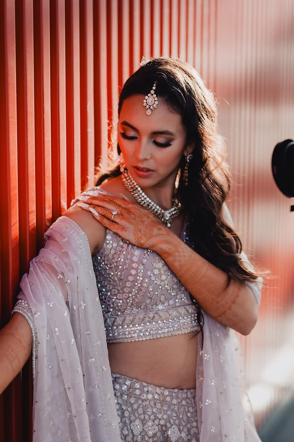 Bride in an ornate traditional Indian outfit