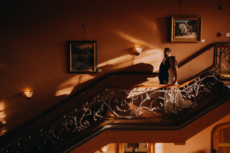 Warm interior staircase and portrait light inside the Maxwell House, Pasadena