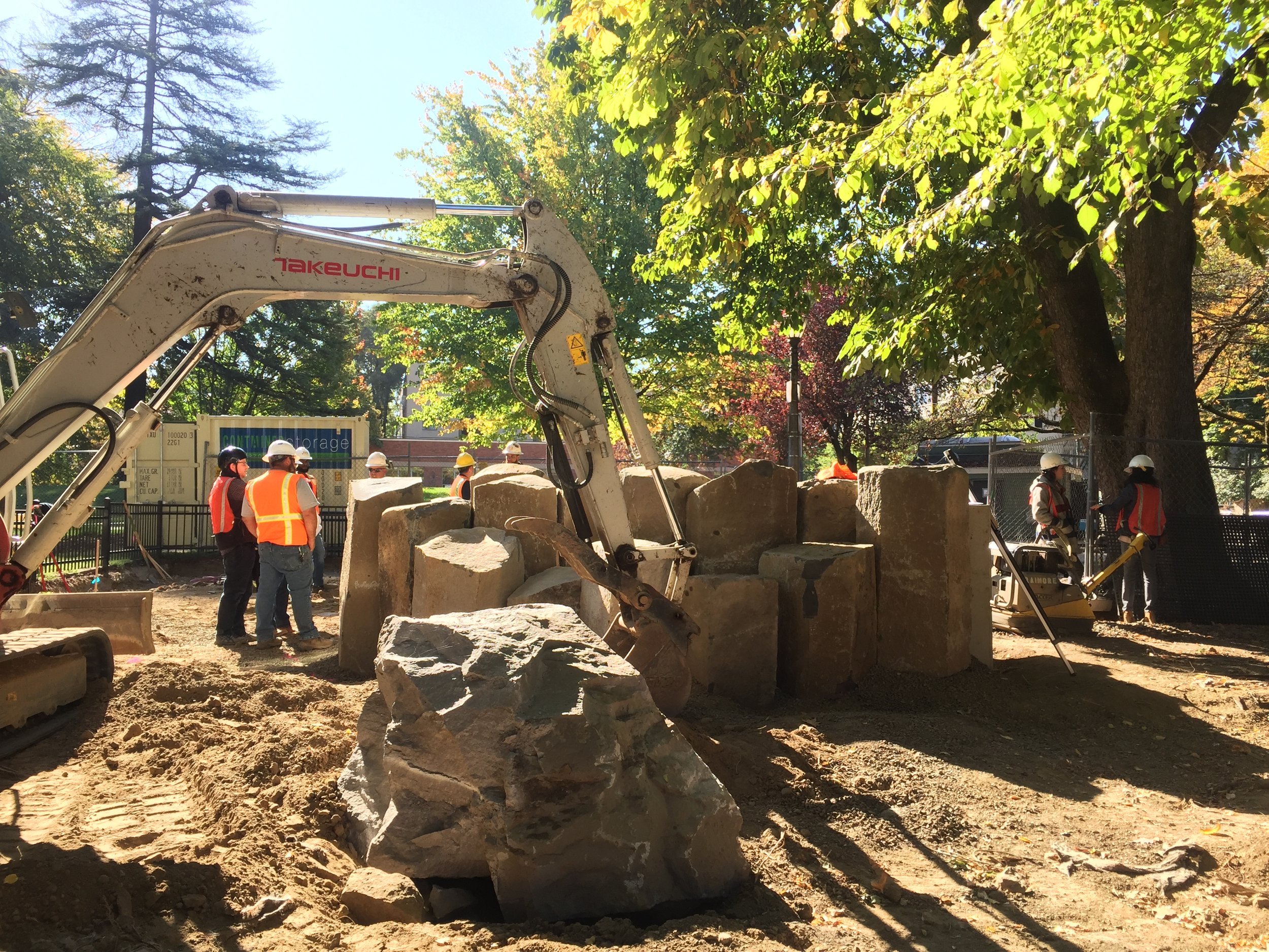 Backhoe Arranging Basalt Columns During Couch Park Construction 