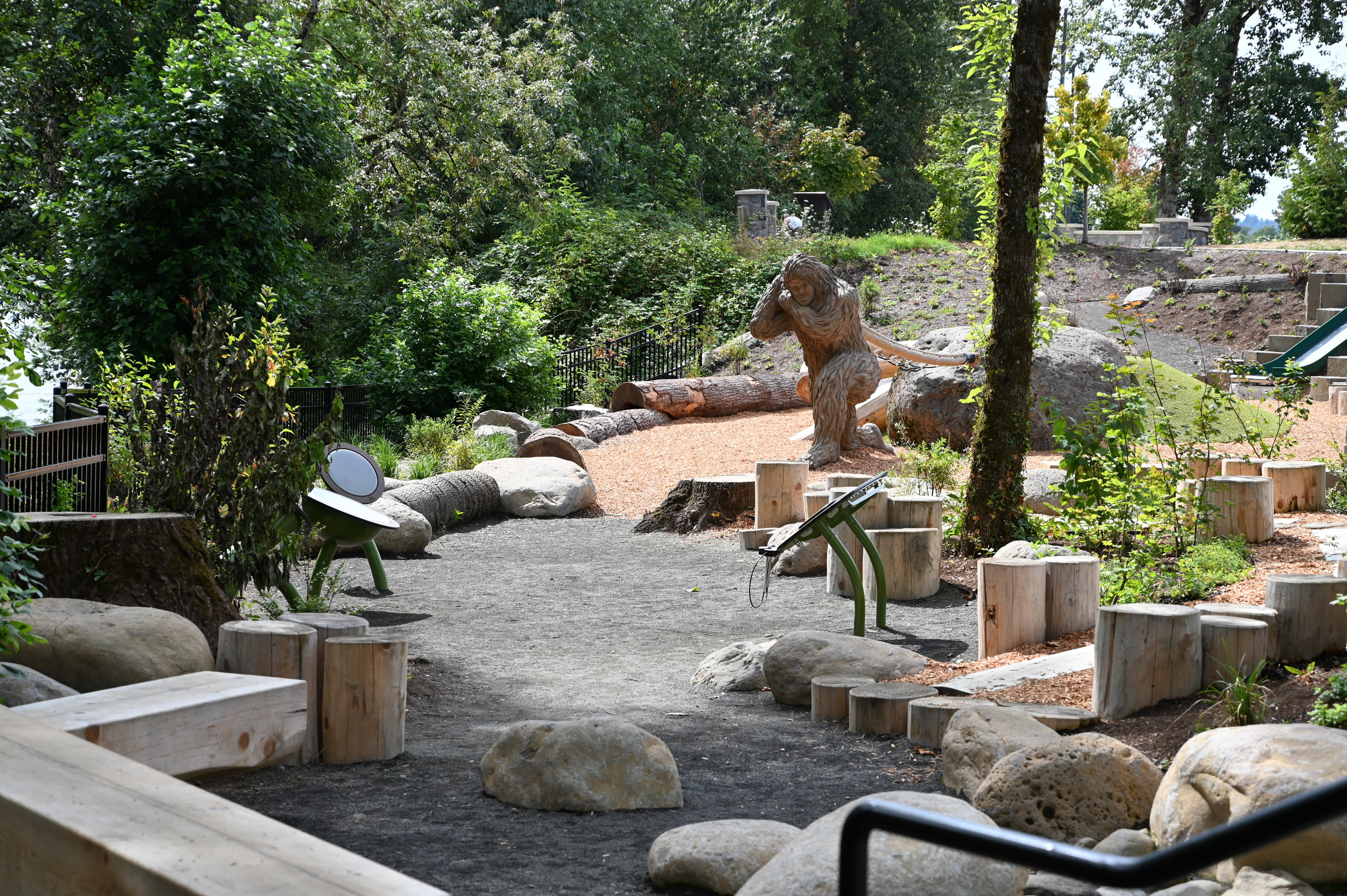 eegah the sasquatch in trees on sunny day at washougal waterfront nature play area