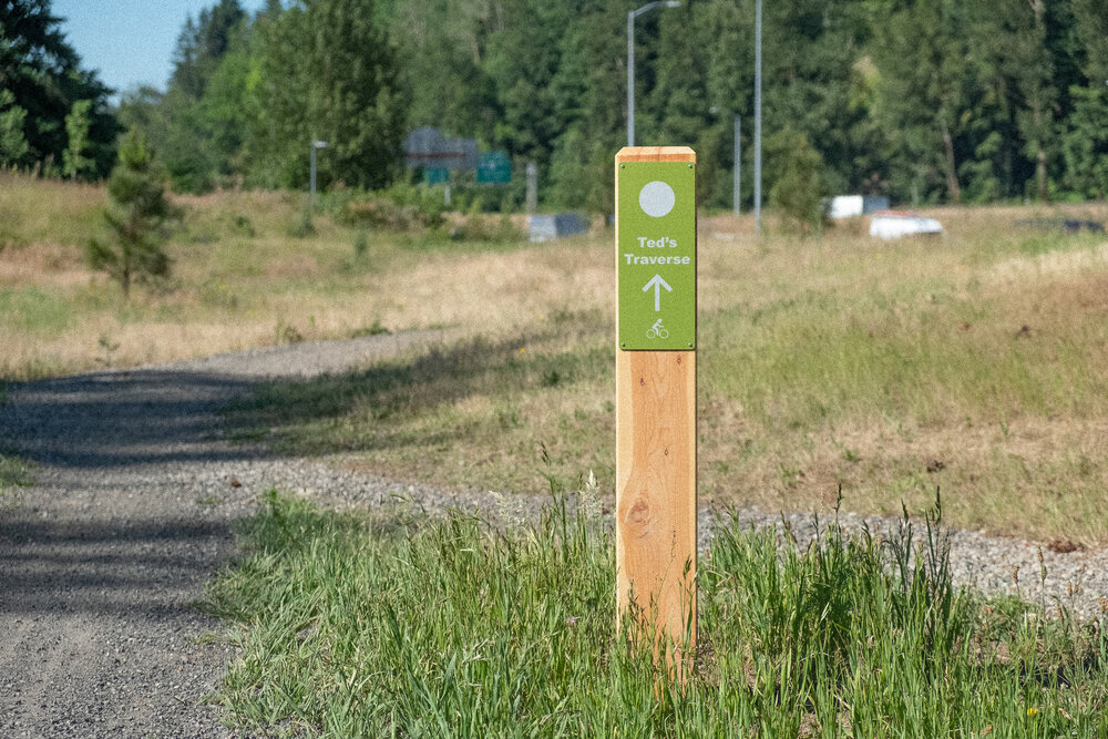 Ted's Traverse trail sign with I-205 in the background