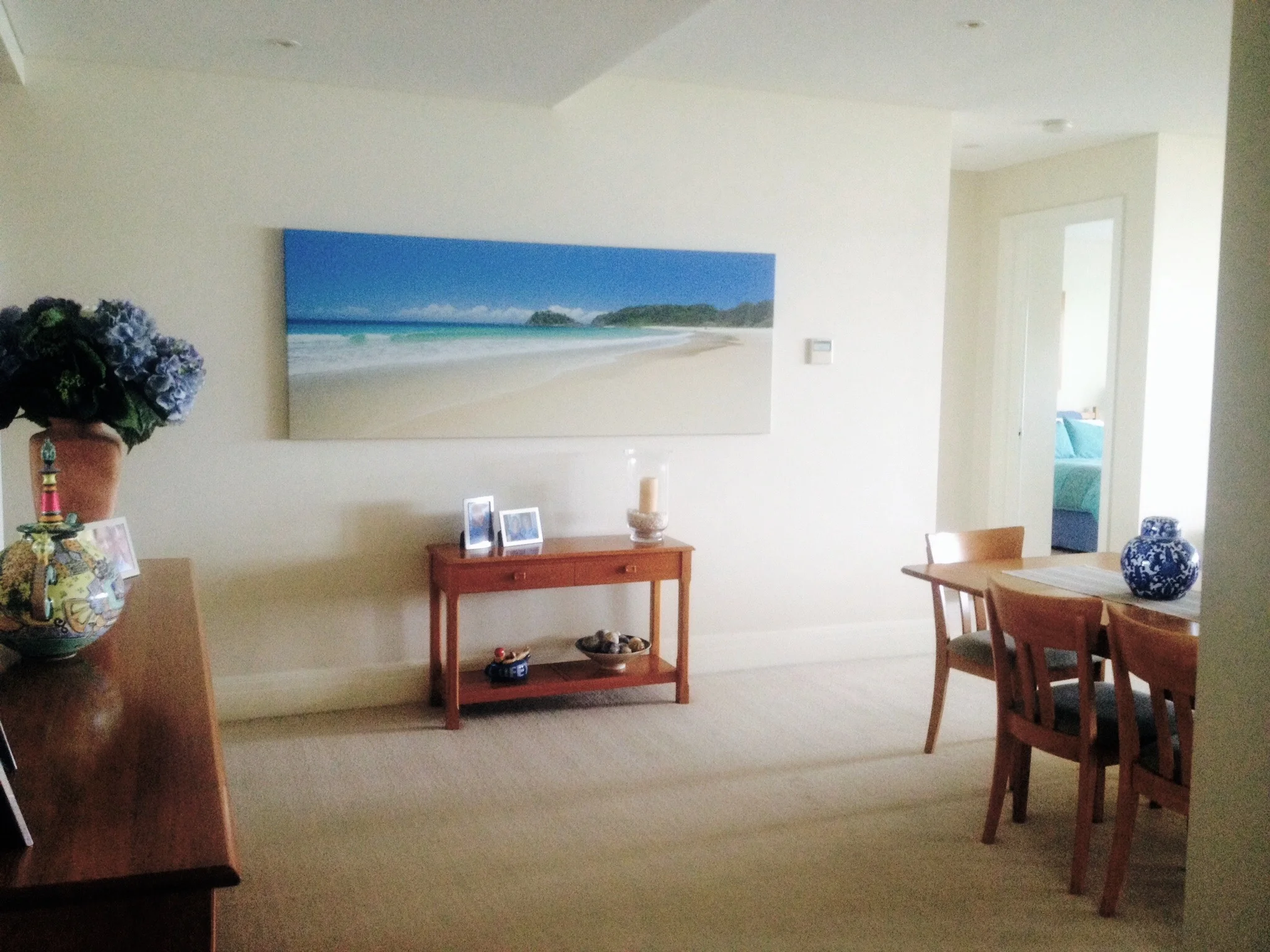 BEFORE. A coastal photograph, blown up into a canvas is used in a very literal way in this before image.