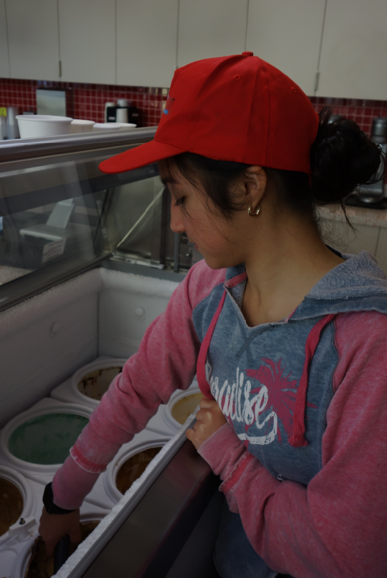 Sweet Retreat employee scooping Ice Cream