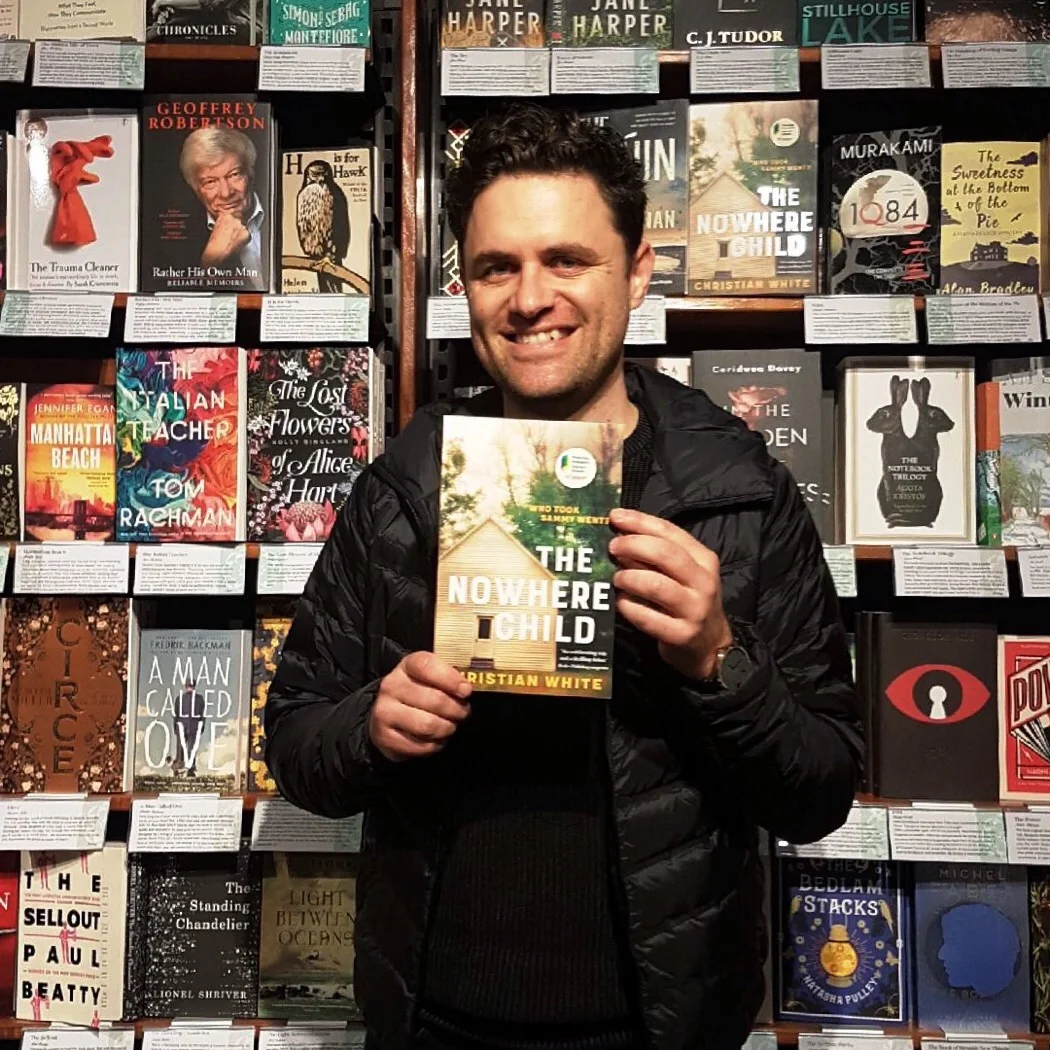 Author Christian White with his debut book,  The Nowhere Child