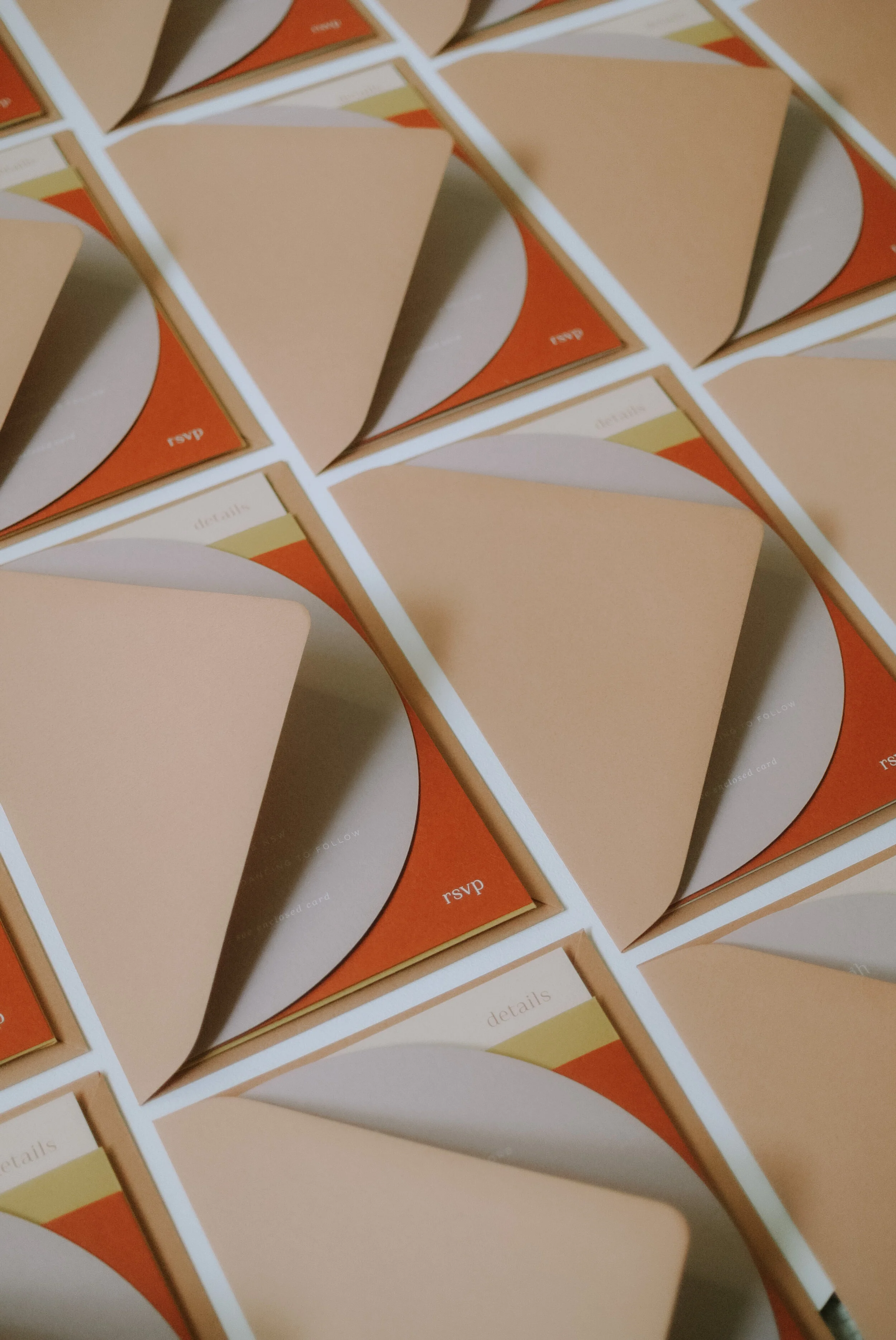 Invitation: White Ink on Wild Rose, 180 x 120mm, Die Cut to Semi Circle, Terracotta Envelope  |  Details Card: Burnt Orange Ink on Biscotti, 120 x 180mm  |  RSVP: White Ink on Burnt Orange, A6, Mustard RSVP Envelope with Burnt Orange Ink Printing  |  I Do Design