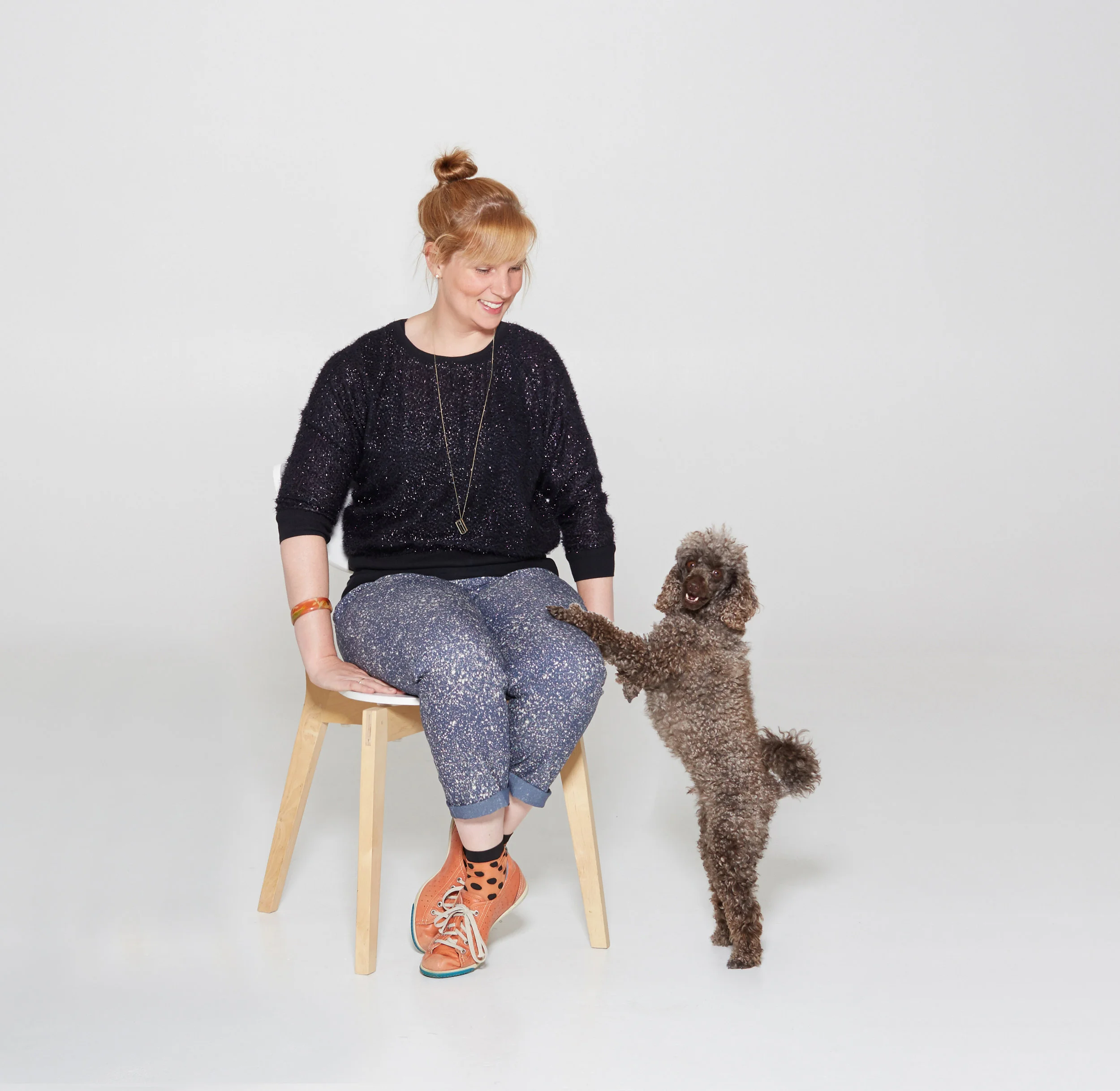 Chelsea, founder of halló cameo and assistant, toy poodle, Benji.