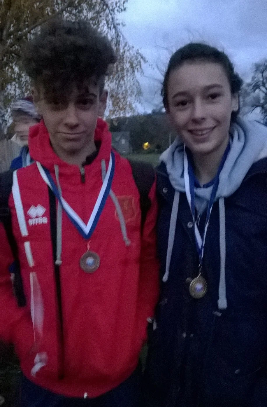 Sam and Tiegan receiving their medals