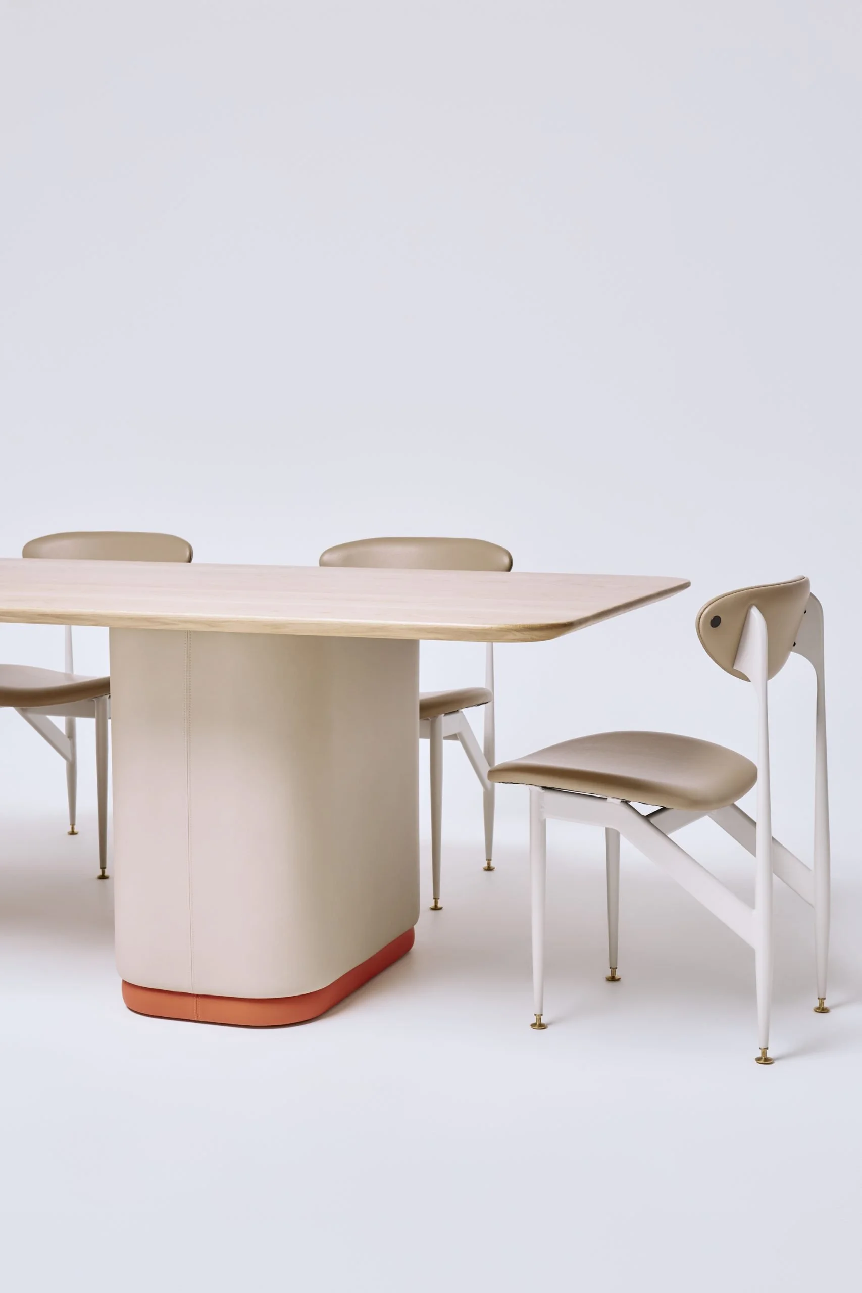 graziaco-turner-table-frost-timber-top-sleek-vinyl-base-in-performance-and-attitude-with-featherston-scape-dining-chairs-scaled.jpg