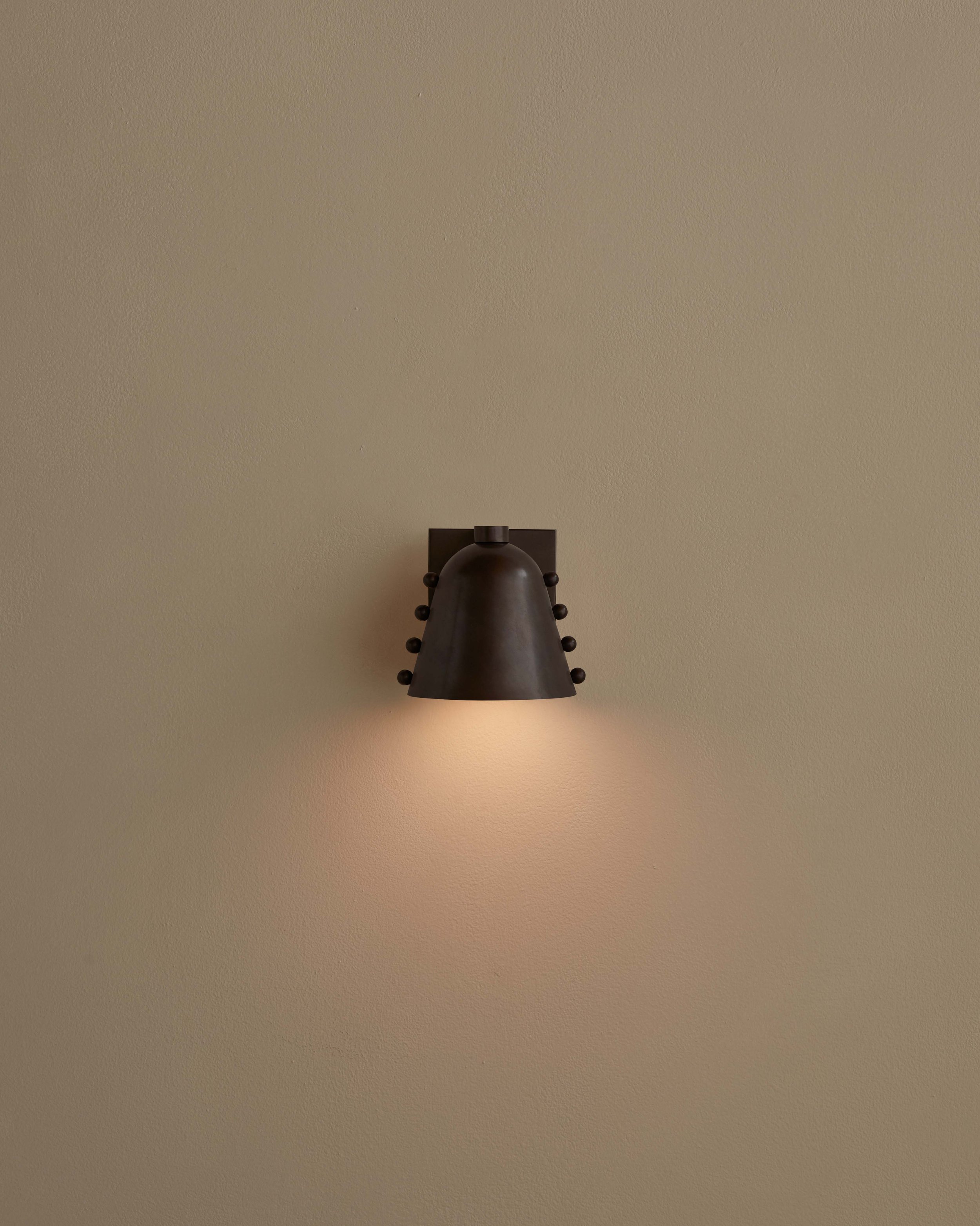 INCOMMONWITH_SCONCE_CALLA_WALL_SCONCE_FACING_DOWN_BLACKENED_BRASS_BLACKENED_BRASS_DOTS_ON.jpg