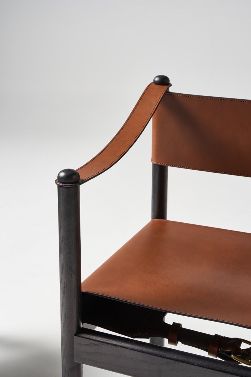 Featherston-Hobb-carver-chair-detail-in-black-timber-and-saddle-leather-in-natural-colour.jpeg