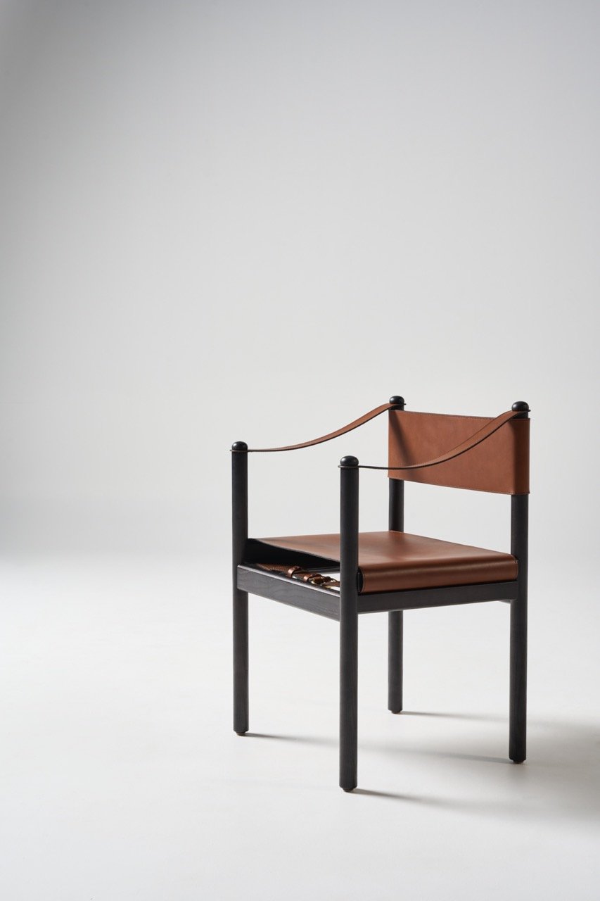 Featherston-Hobb-carver-chair-in-black-timber-and-saddle-leather-in-natural-colour.jpeg