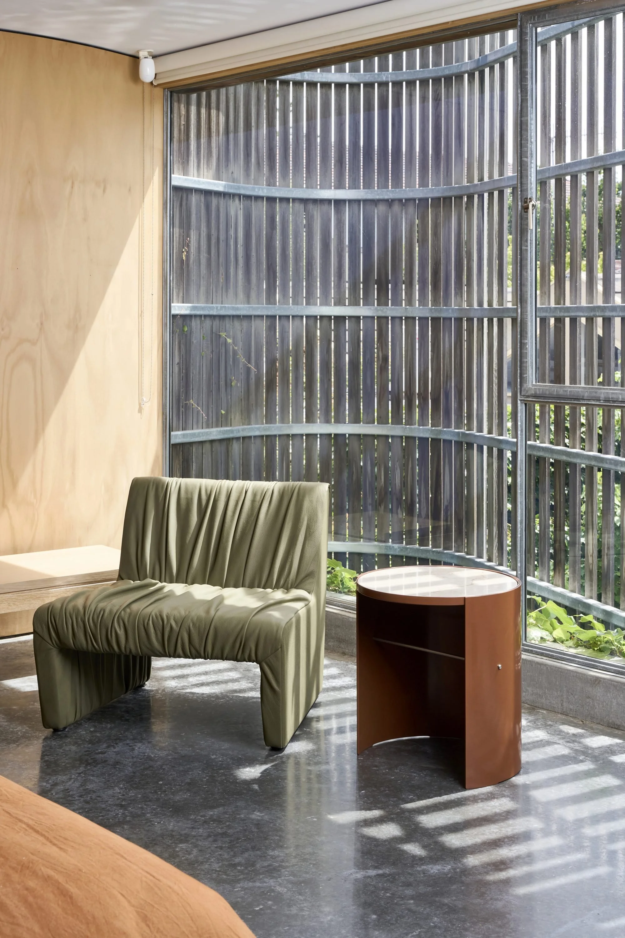 ruched-reeno-leather-chair-and-stamp-side-table-in-earth-PC-and-aurora-stone-top-2000x3000.jpeg
