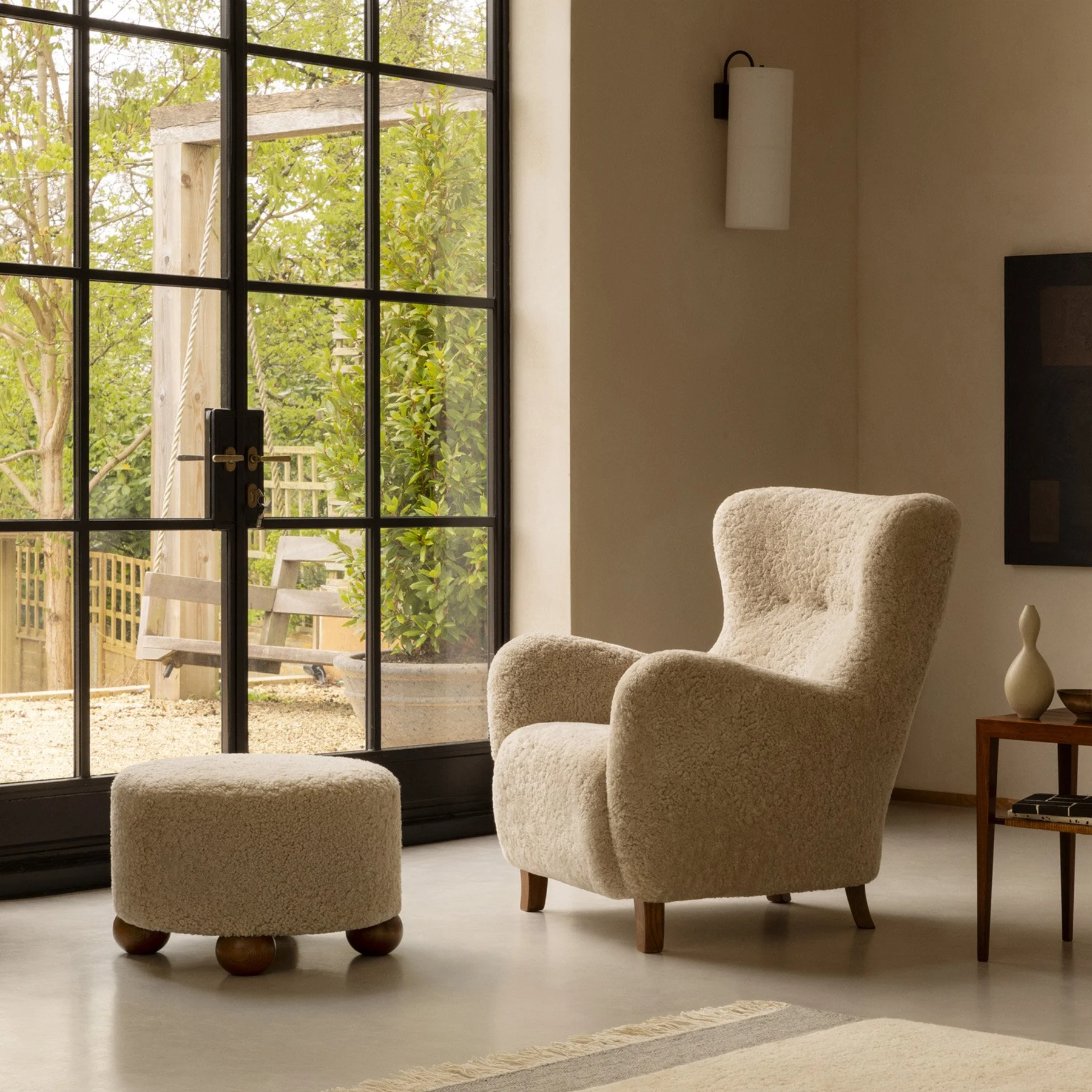 Dagmar's Sampo chair by Christian Sorensen with flowing organic silhouette in sheepskin upholstery on solid beech wood frame, a 1940s Danish Modern design