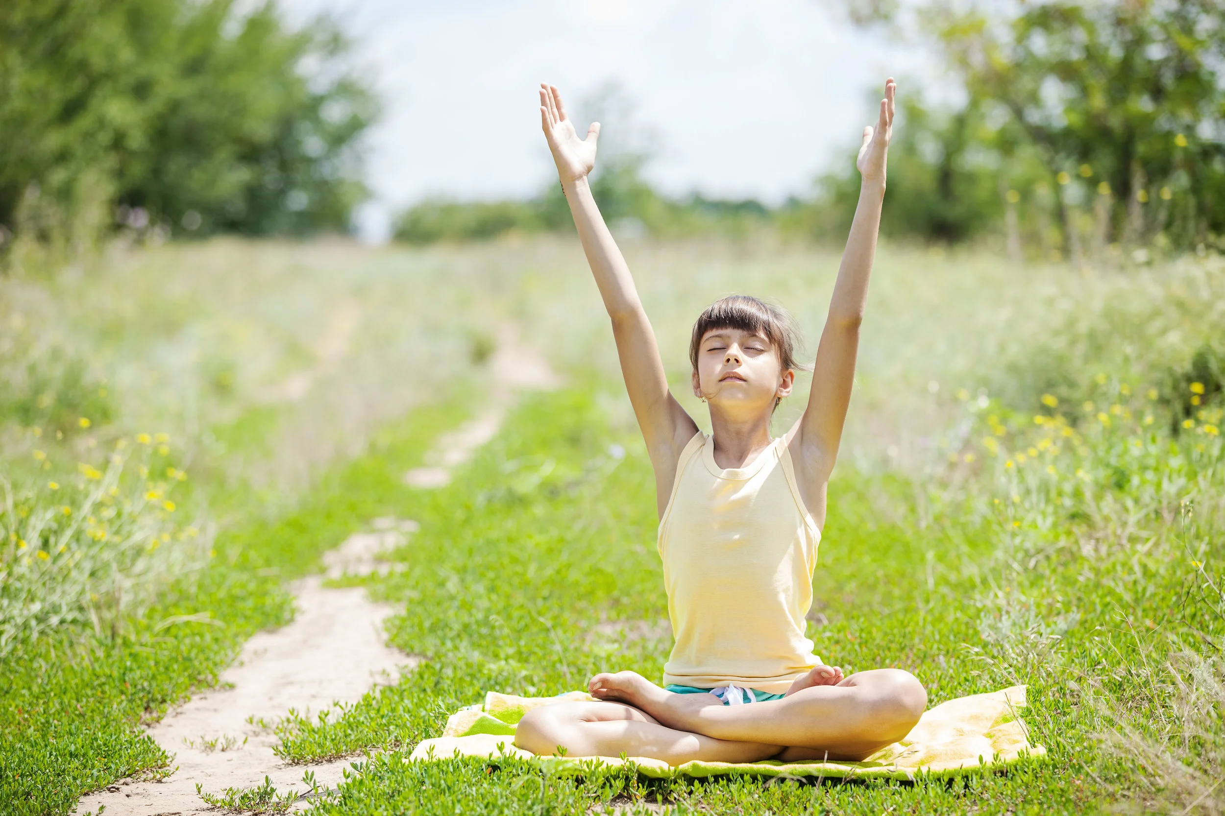 young-girl-practicing-yoga-outdoors-P68U6Q4.jpg