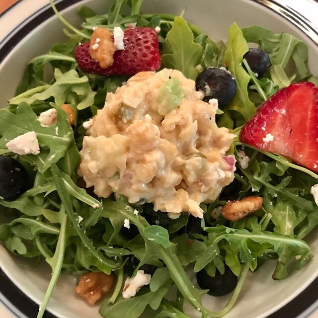 Red, White &amp; Blue salad with a scoop of vegan &ldquo;tuna&rdquo; salad (aka chickpeas and no mayonnaise needed). Sweet strawberries &amp; blueberries, toasted walnuts (omega 3s and healthy fats) , and local goat cheese on top of peppery arugula. 