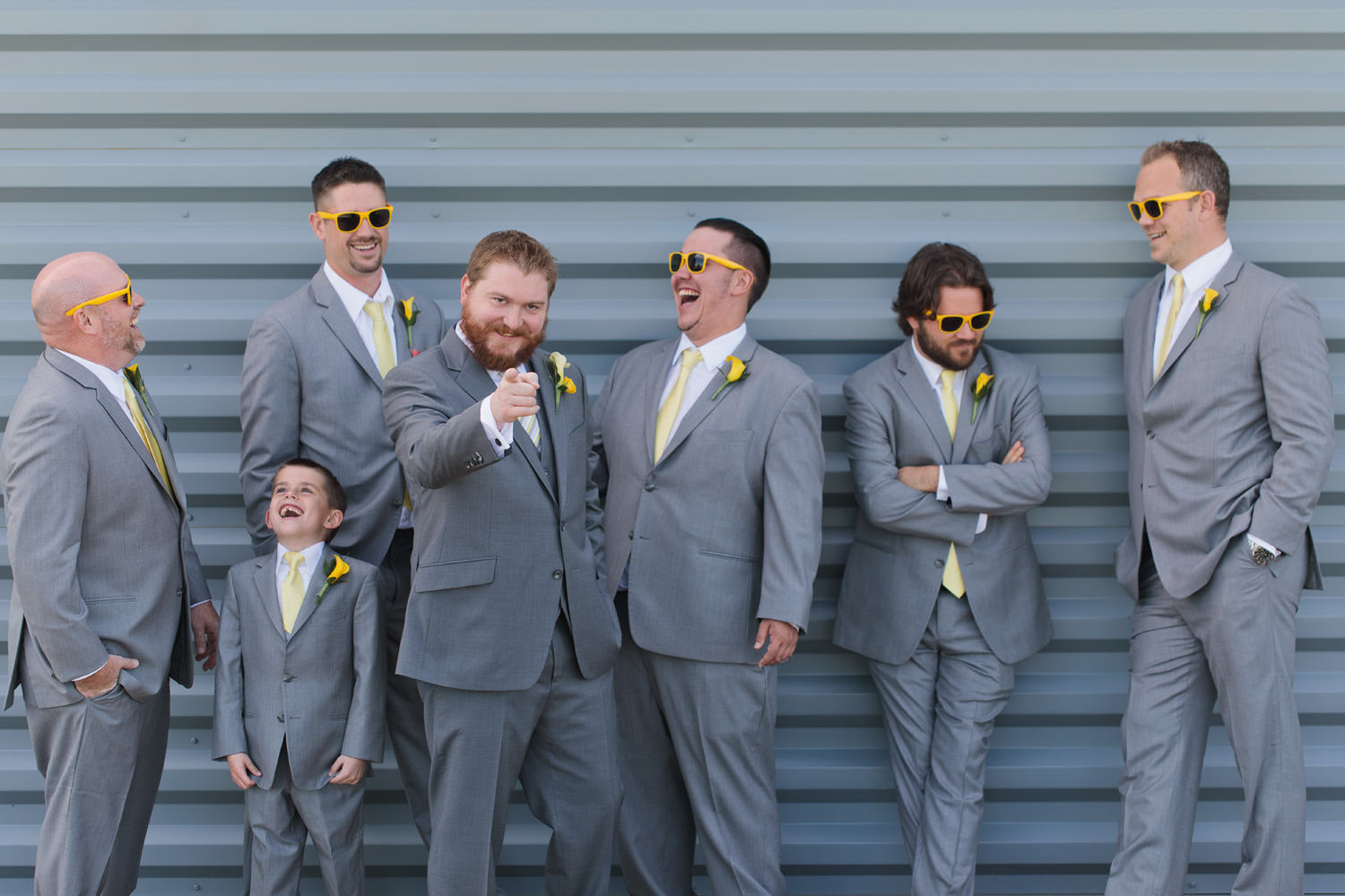 groomsmen share a funny moment as captured by tomKphoto windsong estate wedding photographer