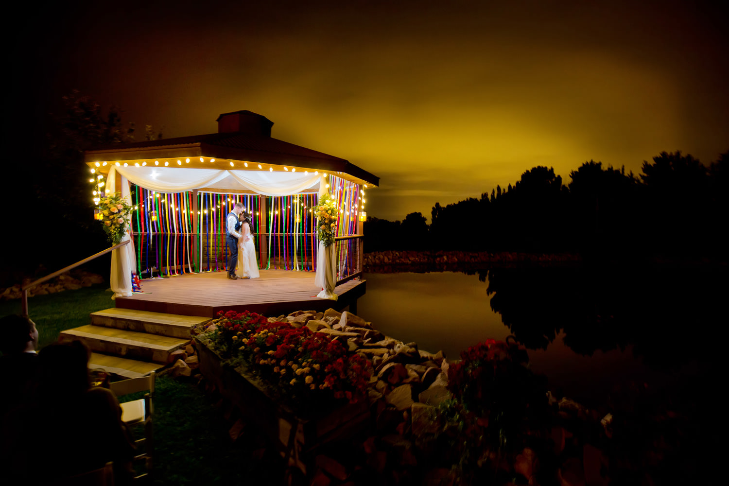 Bride and groom relax under moonlight under during a preserve and bingham hill wedding near Fort Collins, Colorado