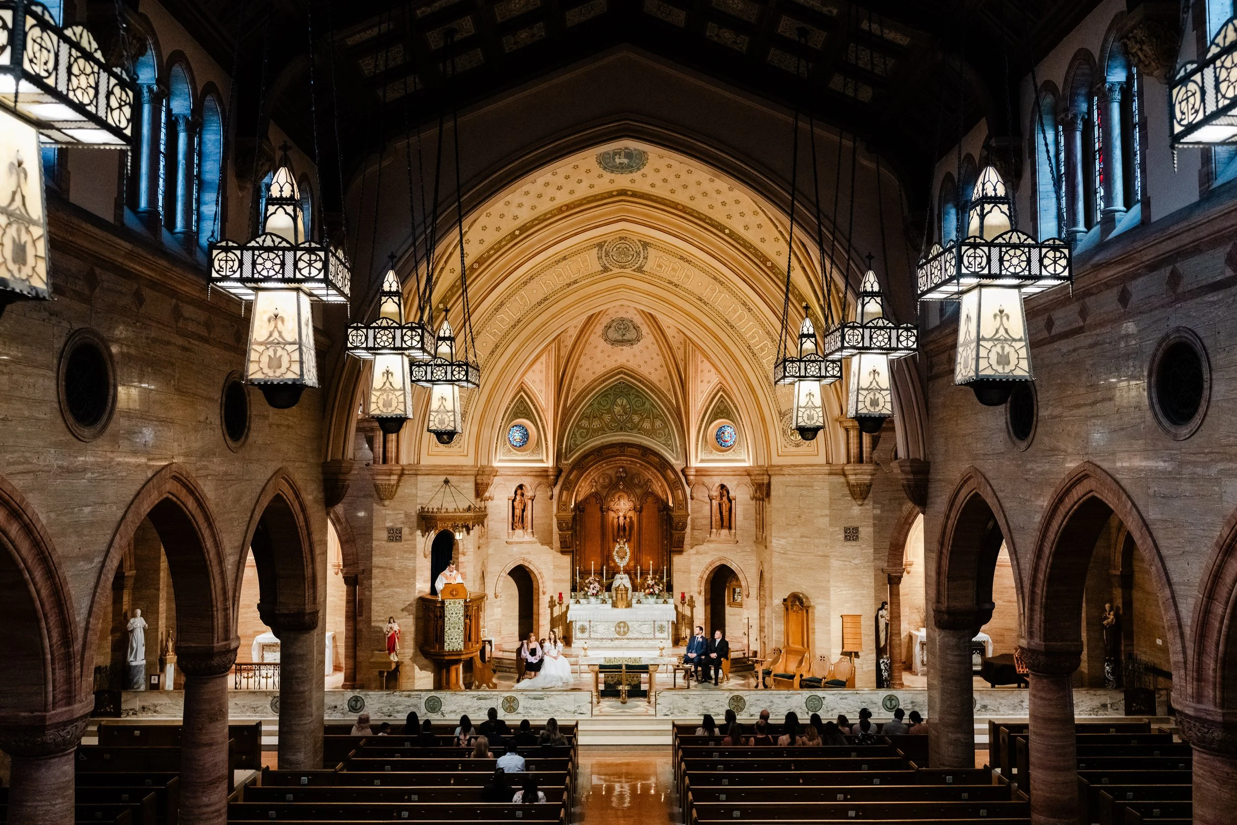 Complete sanctuary view as seen from the balcony just before a Holy Ghost catholic church wedding in Denver, Colorado