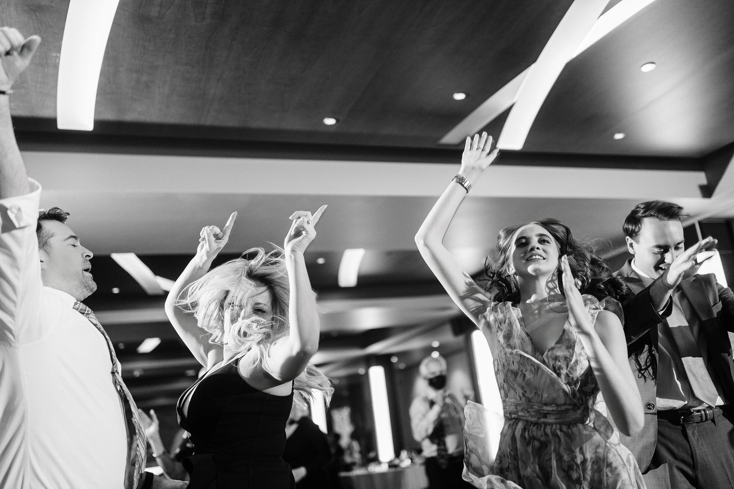 Blonde hair flying during a raucous dance party during a Mount Vernon Canyon Club wedding reception in Golden, Colorado.