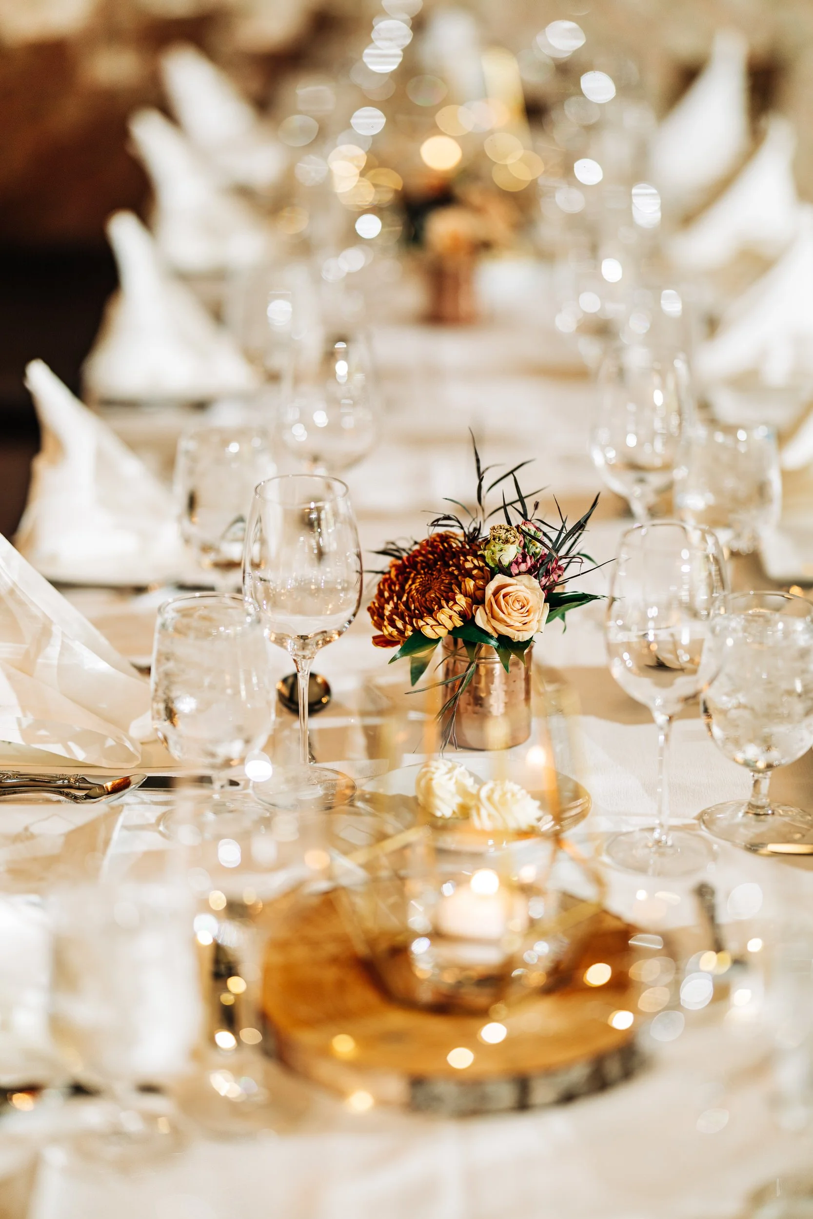 Formal tablescapes with place settings and floral arrangements for a wedding reception at Greenbriar Inn in Boulder, Colorado