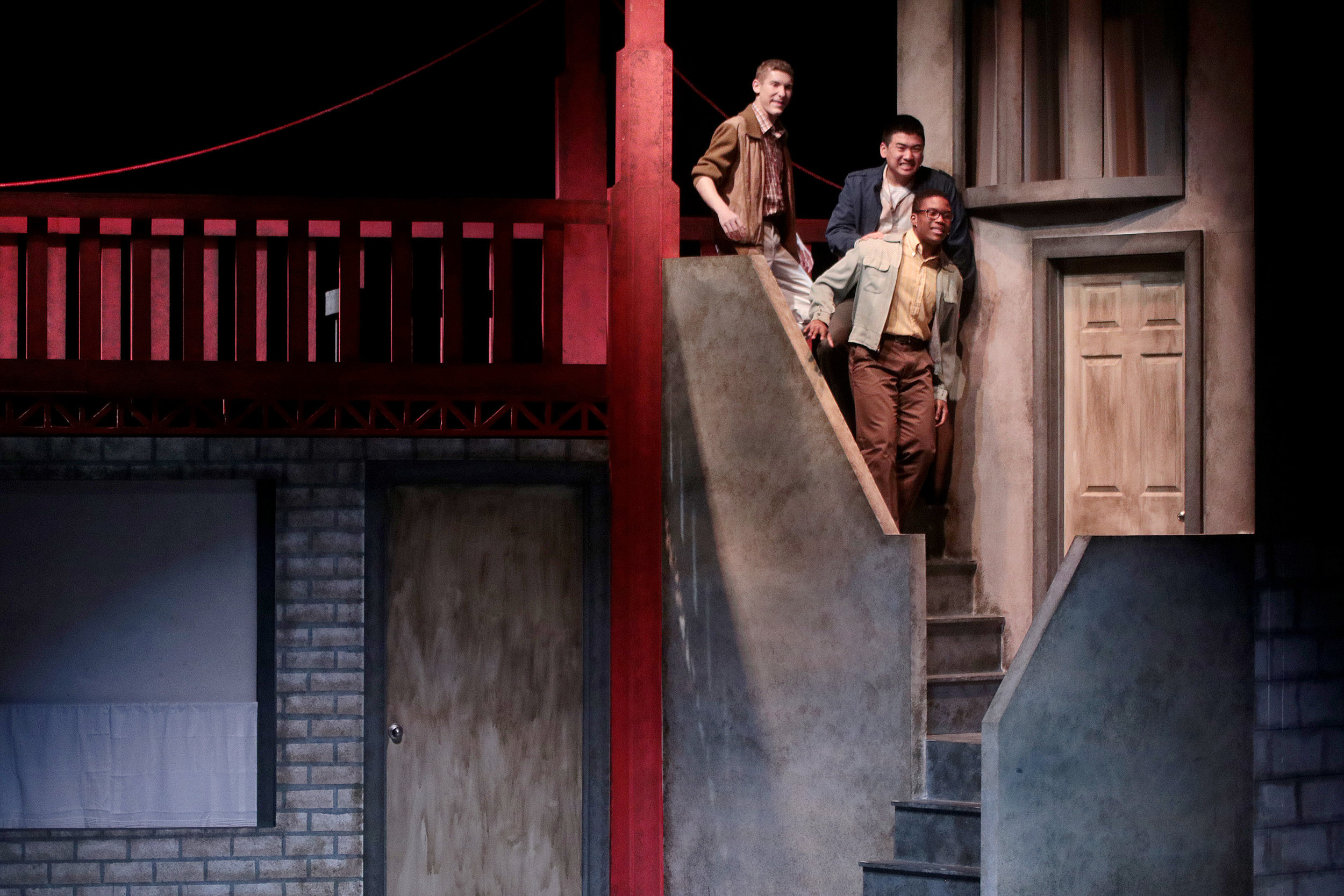  Dogfight trio peering over stairs 