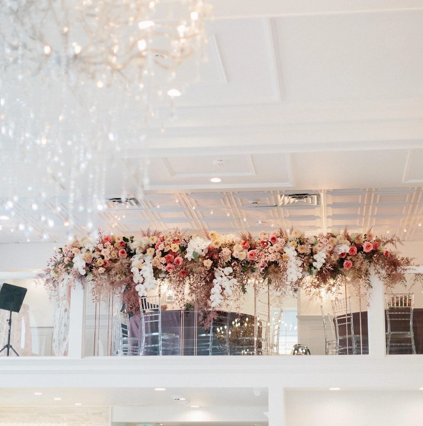 Elegant floral installation above reception space at The Treasury wedding venue in Delavan Wisconsin near Lake Geneva