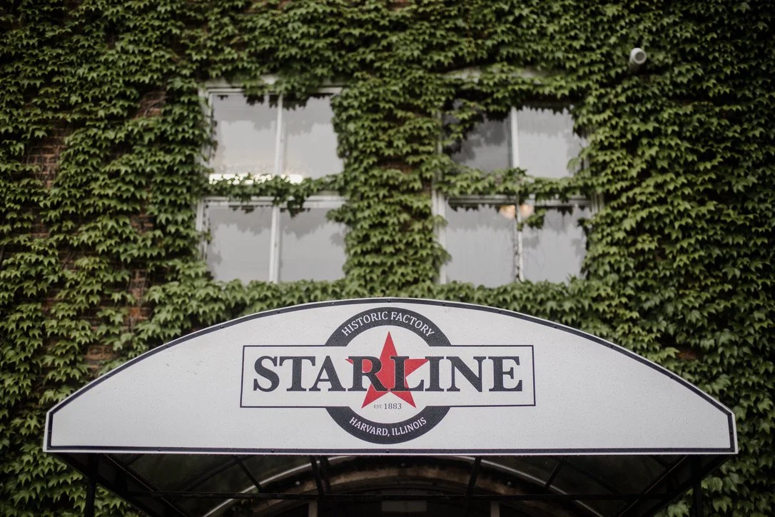 Starline Factory entrance canopy on ivy-covered historic brick building in Harvard Illinois wedding venue