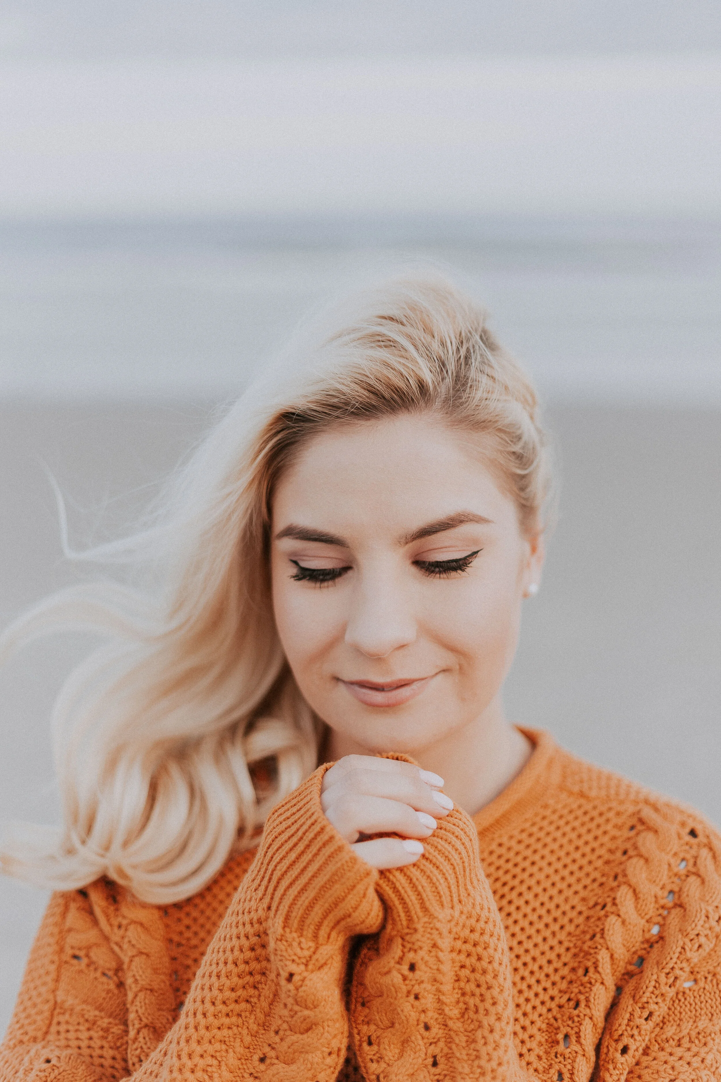 blonde-haired-woman-in-orange-knitted-long-sleeved-top-1097781.jpg