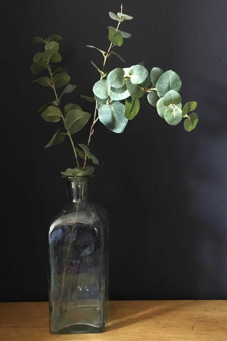Vintage tall glass bottle