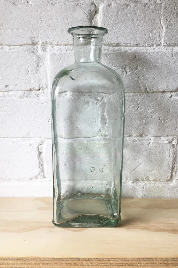 Vintage tall glass bottle