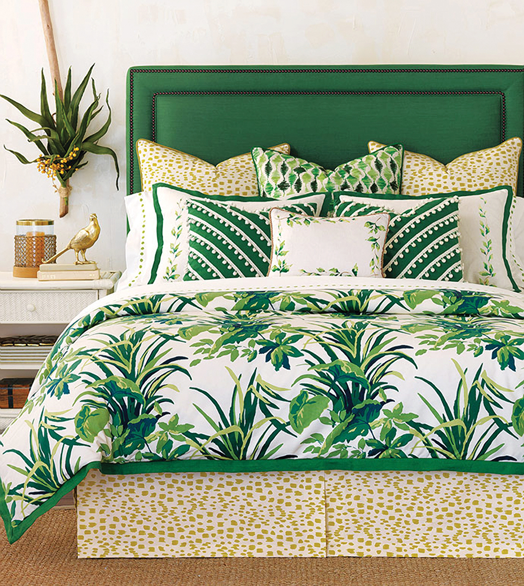  Retro is big—people are looking to old Hollywood for inspiration as shown in this Palm Springs feel bedding and headboard combo in vivid emerald green paired with natural tone animal prints. 