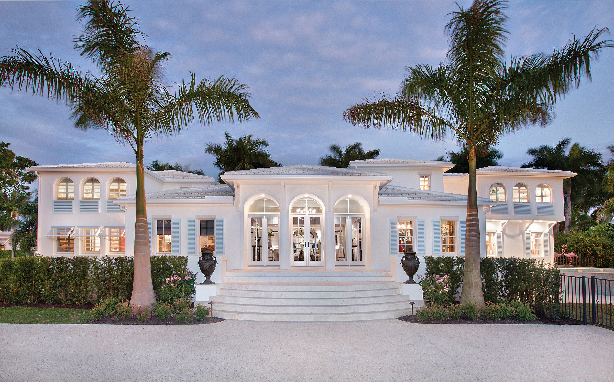  As the Bermuda-style home is viewed from the new custom-poured shell driveway one would never guess at the extensive redesign and artfully executed renovation which took place. The orientation of the home was changed from the narrow side street to f