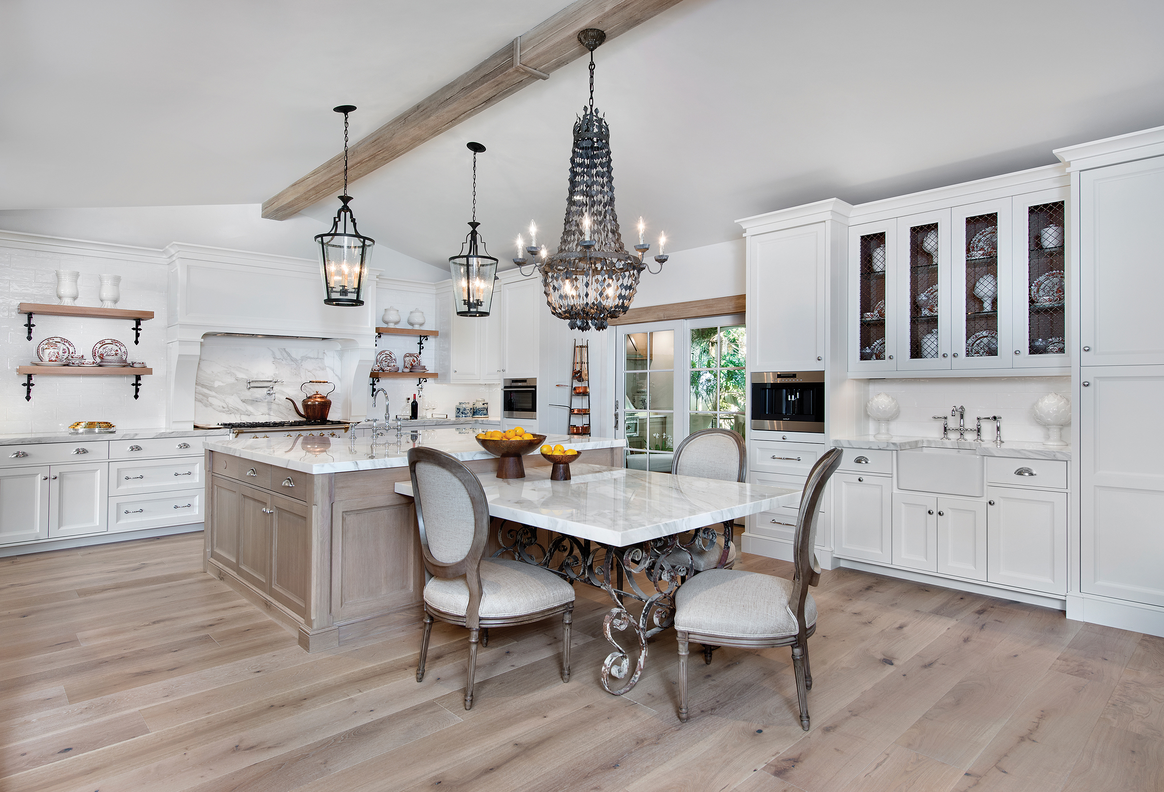  The French country kitchen is consistently one of the favorite rooms in the home. Designed by Carol Ruffino and manufactured by Ruffino Cabinetry, the Alabaster White-finished cabinets provide the perfect canvas on which to build. Wire-grill door in